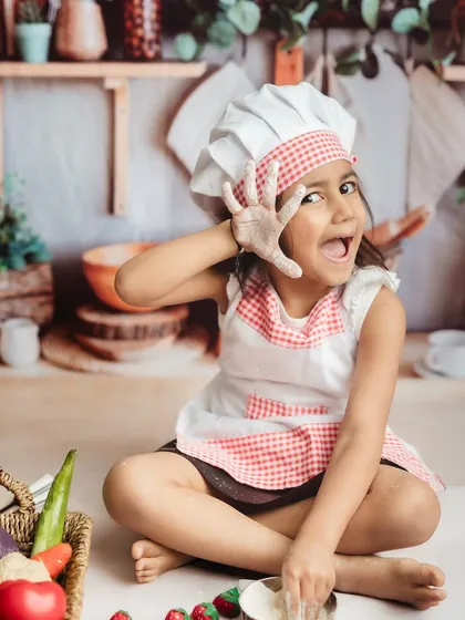 A playful, flour-dusted pose! I encourage kids to be themselves and have fun during our photoshoots.