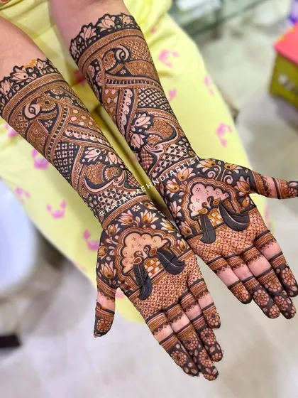 A non-figurative bridal design that uses bold lines and negative space to create a striking effect. The peacocks on the palms are a beautiful touch.