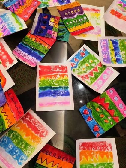 A beautiful burst of color and pattern created by my 4 to 7-year-old students. These small studies are a great way for them to experiment with different watercolor techniques and designs.