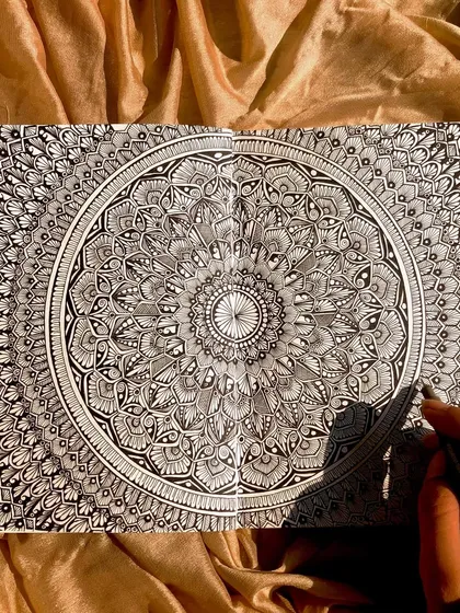 A full-spread, highly detailed mandala that took hours of focused work. There's something so satisfying about filling two entire pages with intricate patterns.
