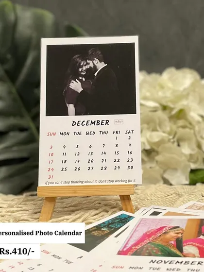 A close-up of a personalized photo calendar for December. The black and white photo gives it a classic, romantic feel, perfect for an anniversary or couple's gift.