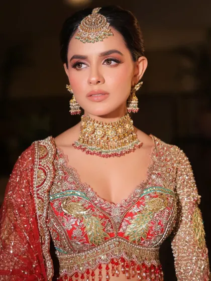 A close-up of the intricate peacock embroidery. This detail was a central part of my styling concept, bringing a touch of traditional artistry to the bridal ensemble.