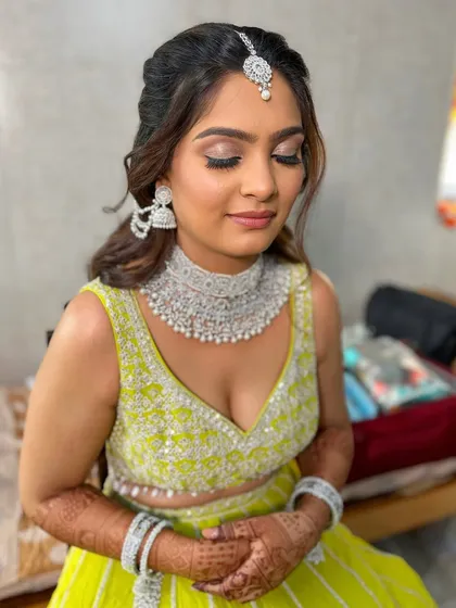 A close-up of the lime green look, showing the soft shimmer on the eyes and the flawless base.