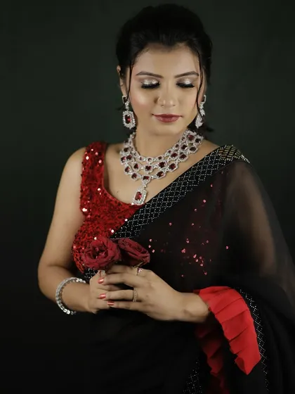 The complete party ensemble. The makeup is designed to complement the heavy jewelry and sequined outfit, creating a balanced and stunning look.