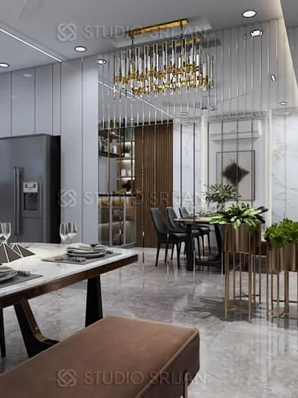 The dining area of the Rajasthali Apartments project, seamlessly connected to the living room. A modern chandelier hangs over the marble-top table, and a mirrored wall enhances the sense of space and light.