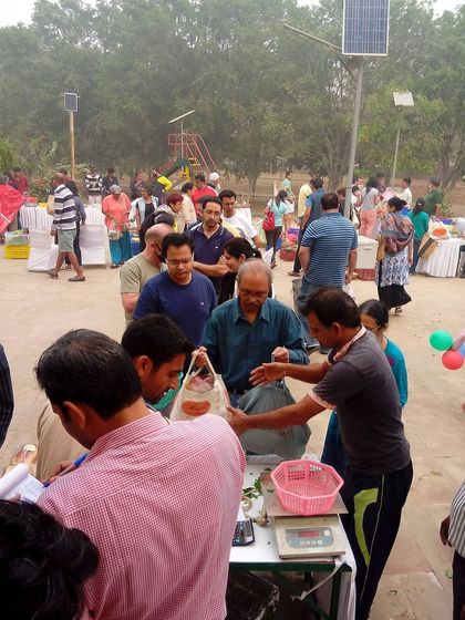 A crowd of people at the market, showing its popularity as a weekly festival.