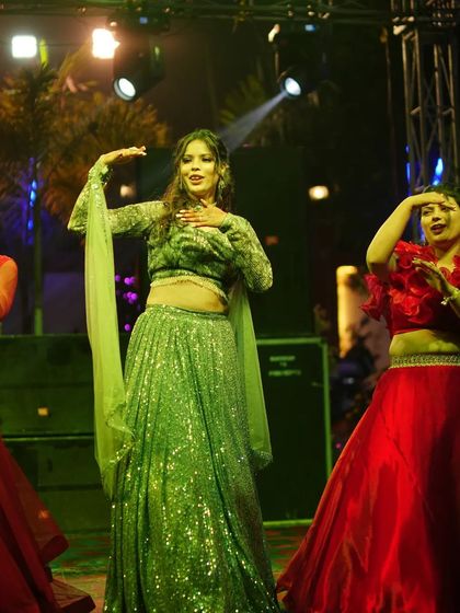The bride and her bridesmaids performing together. This is a great way for the bride to share a special moment with her closest friends.