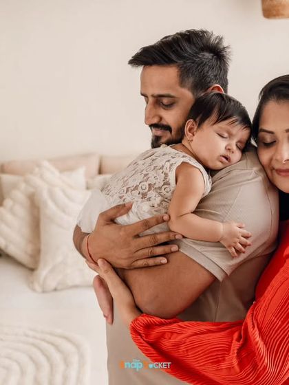 In this quiet moment, a new family of three shares a hug. These unposed, candid shots are often the most powerful, showing the deep connection and love you share.