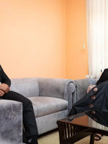 In a discussion with a colleague before the moot court session. We often exchange notes and thoughts on the students' performances to ensure a fair and comprehensive evaluation.