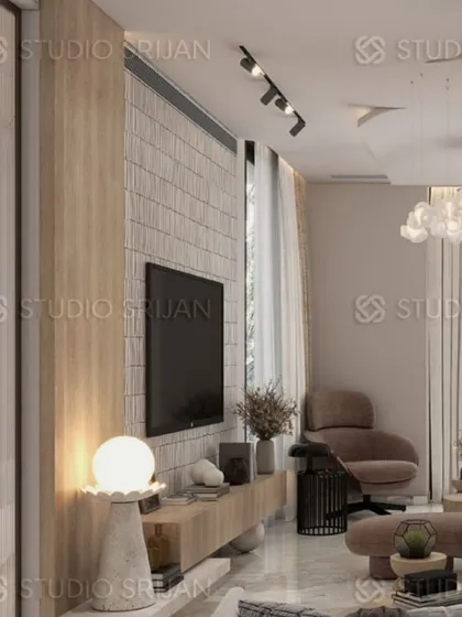 This common area in Greenwood City, Gurgaon, features a TV wall with a mix of light wood and textured white brick, creating a bright and modern Scandinavian-inspired look.