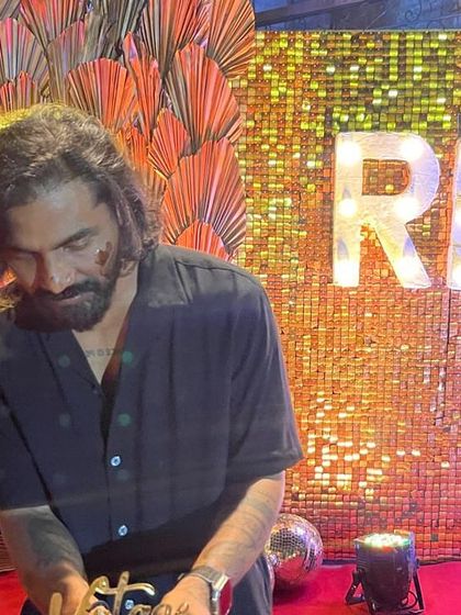 The birthday boy enjoying his celebration in front of the custom backdrop. My setups are designed to make the guest of honor feel special.