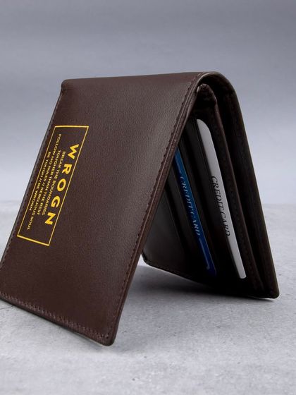 A standing shot of the 'WROGN' wallet, showing cards inside.