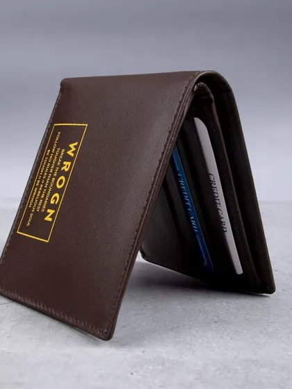A standing shot of the 'WROGN' wallet, showing cards inside.
