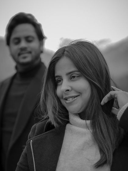 A beautiful black and white portrait of the bride, her expression soft and happy, from a post-wedding shoot.