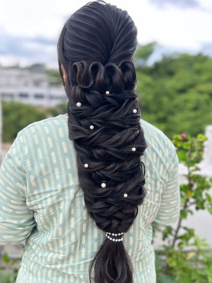 A close up of the detailed weaving and looping in this unique and modern braid.