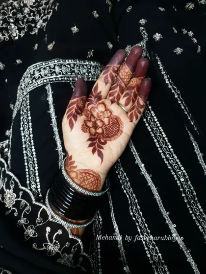The deep color on the fingers and palm is a sign of high-quality, all-natural henna.