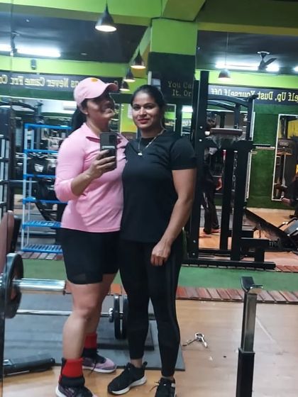 With a friend at the gym. Having a training partner can make all the difference.