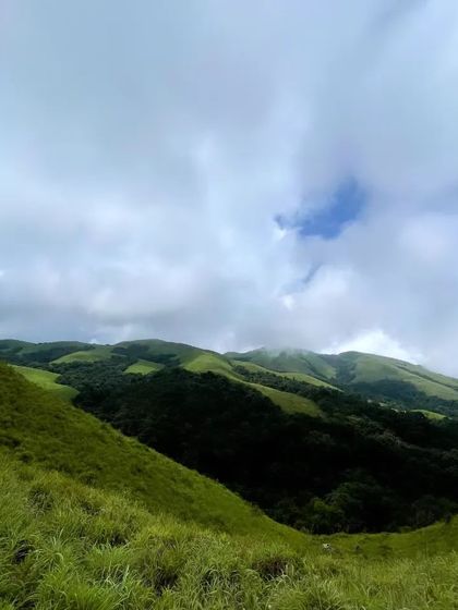 Another view of the beautiful green hills we trek through to reach the waterfalls.
