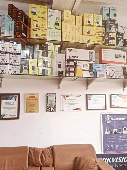 A look inside my new branch, where I keep a wide variety of security products in stock. You can also see my authorized partnership certificates on the wall, which are a testament to the trust major brands have placed in me.