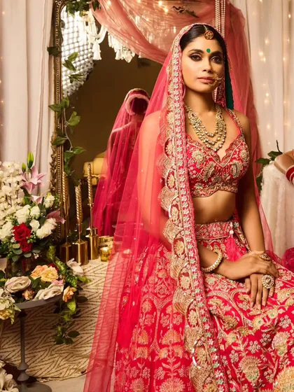 A complete bridal look that feels both classic and modern. I focused on creating a flawless base that would last all day, with defined eyes and a soft lip color to complement the stunning red lehenga. The hair is styled in a clean, elegant updo to keep the focus on the bride's features and her beautiful veil.