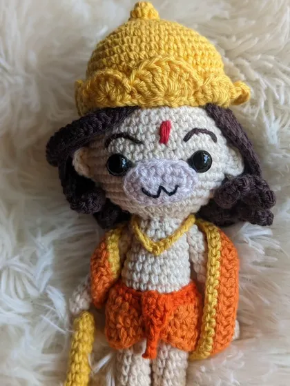 The Hanuman doll against a soft, white background.