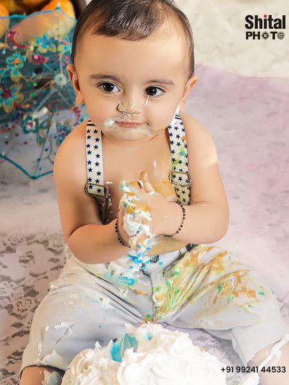 The aftermath of a successful cake smash. This close-up captures the messy, joyful evidence of a fun first birthday celebration.