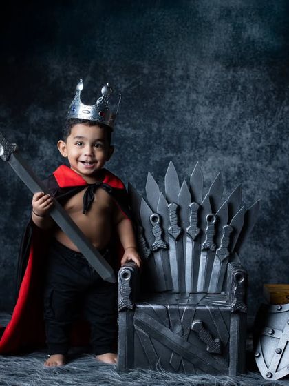 A joyful king standing proudly next to his throne, ready to lead his people.