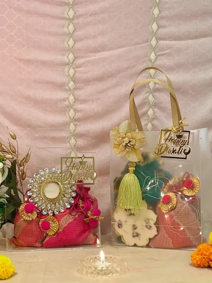 My modern gifting solutions are designed for chic, effortless style. These translucent bags are a contemporary way to present festive gifts, offering a tantalizing peek at the beautiful potlis, diyas, and treats nestled inside.