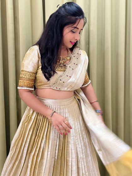 A candid twirl shows the beautiful movement of the pleated skirt. This outfit is light, comfortable, and perfect for a performance or a long day of festivities.