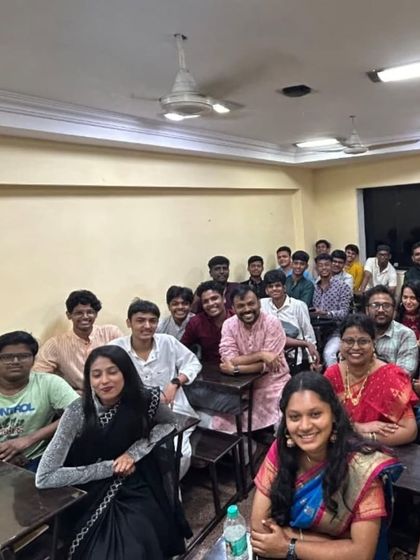 Another angle of the festive classroom during Diwali, with everyone enjoying the celebratory atmosphere.