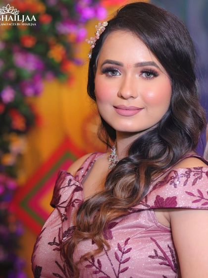 A close-up of this engagement look. The makeup features soft pink tones on the eyes and lips, creating a fresh and youthful glow perfect for the occasion.