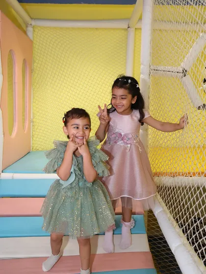 Posing and playing inside our colorful climbing structure during a royal princess party.