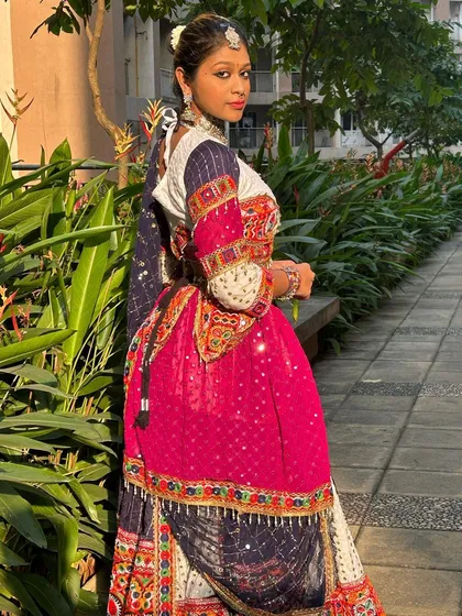 A look from the back, showing the intricate details and layering of this Gangubai-inspired outfit.