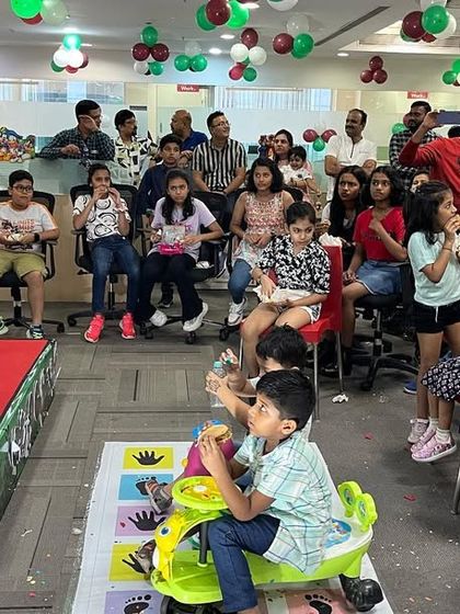 After the main show, it's time for treats. The kids at this corporate event are enjoying some snacks while still buzzing with excitement from all the magic they just witnessed.