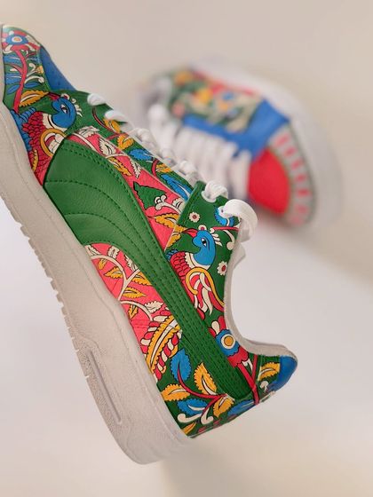A detailed close-up of the Madhubani art. I love how the green Puma stripe integrates into the overall design, becoming part of the artistic landscape of the shoe.
