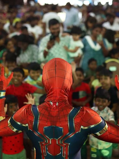 Spiderman greets his adoring fans. Our performers are skilled at managing crowds of excited children, ensuring everyone gets a chance to see their hero up close.