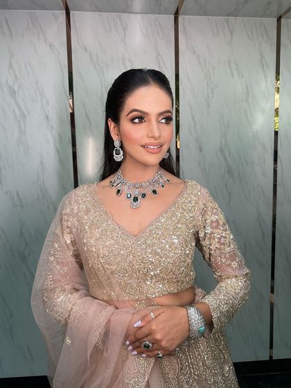 A beautiful candid shot of the bride, her jewellery sparkling in the light.