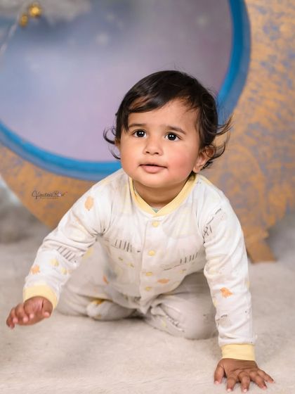 A cozy pajama-themed shoot on our moon set. The soft lighting and cloud props make it the perfect backdrop for capturing sleepy, angelic moments.