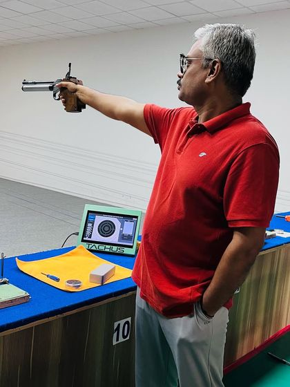 A Master category shooter takes aim during a practice session. His focus demonstrates that passion and competitiveness in shooting have no age limit.