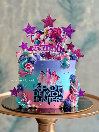For the K-Pop fans, this "K-Pop Demon Hunters" tall cake was a blast to create. The vibrant colours and glittery star toppers make it a true showstopper for a 6th birthday.