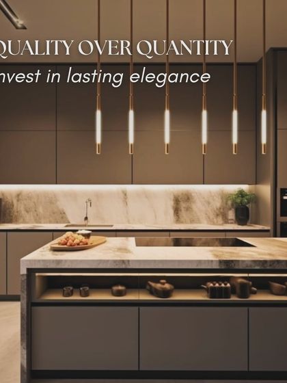 Quality over quantity is a key principle of minimalist design. This kitchen uses a neutral palette, a stunning marble backsplash, and elegant pendant lighting to create a sense of lasting elegance.