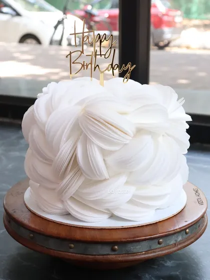 This cake is all about modern texture and minimalist beauty. I used delicate, paper-thin wafer paper to create this stunning, all-white feathered effect. It's a simple yet incredibly artistic design for any sophisticated celebration.