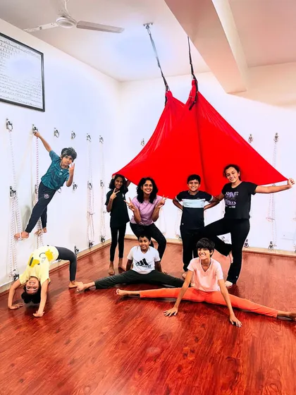 My kids' aerial yoga batches are all about playful exploration. It's a space for them to swing, stretch, giggle, and build confidence. Look at these happy faces and strong poses.