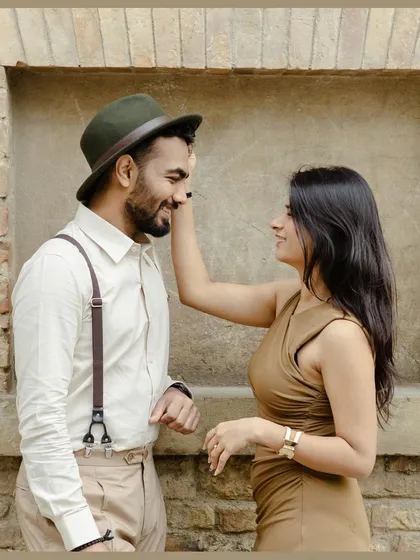 A playful, tender moment during a European pre-wedding shoot. We help with styling to ensure your outfits complement the vintage and romantic feel of locations like Florence or Tuscany.