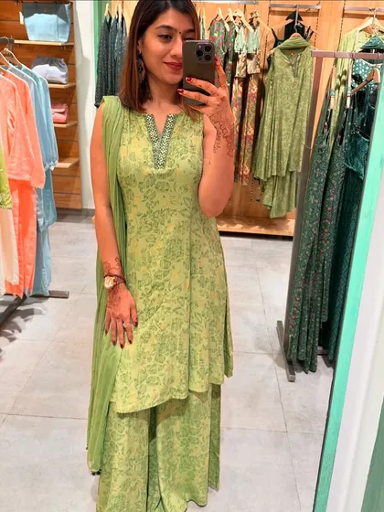 Trying on a lovely light green printed sharara set at Global Desi, a great option for a daytime festive event.
