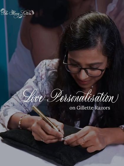 A shot of me focused on personalizing a Gillette razor. Even on a small surface, the goal is to create a clean, beautiful script that transforms an everyday item into a special keepsake.