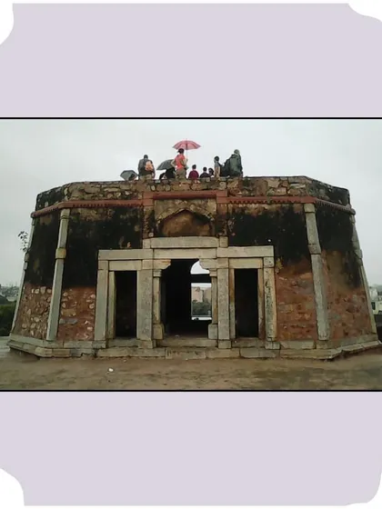 A group sits atop the octagonal pavilion of Bijay Mandal. This structure offers a panoramic view and is a highlight of our Jahanpanah walk.