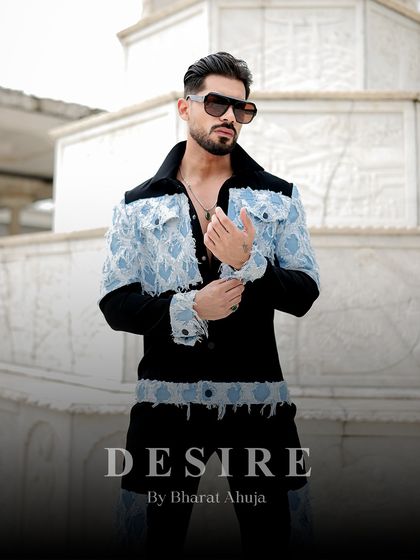 This shot highlights the fearless detailing of the denim patchwork jacket, from the frayed edges to the carefully placed panels.