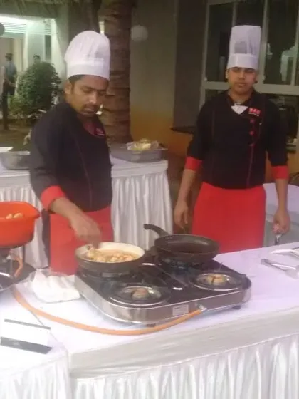 Another view of our live pasta station at an evening event. Our chefs in uniform are prepared to cook delicious pasta dishes for your guests.