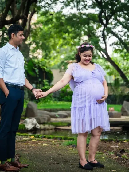 This couple's connection is so sweet. I captured them holding hands in a beautiful park, with the mom-to-be glowing in a lovely lavender dress.